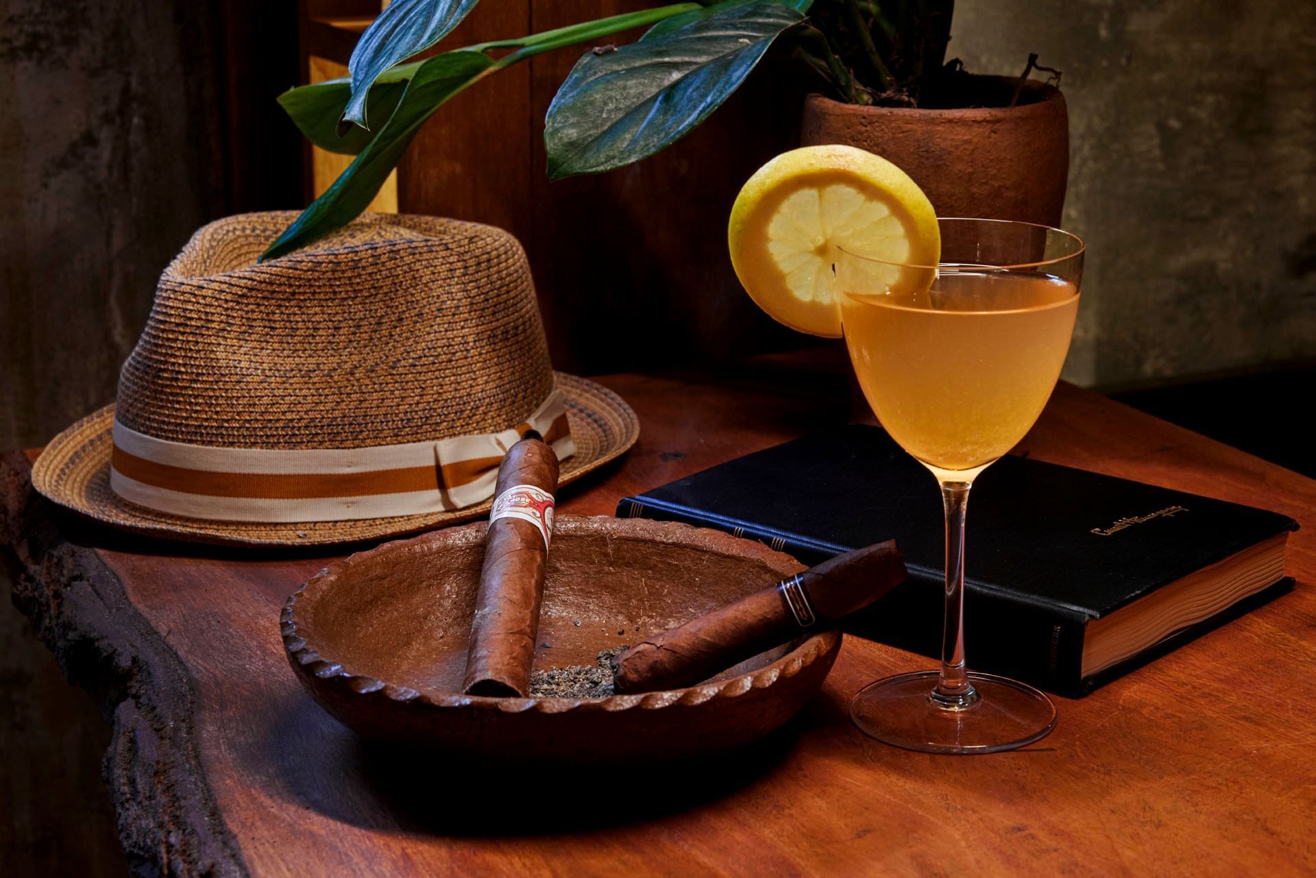 Cocktail glass served with Big cigars in Hideaway Rum Bar at Ladera Resort