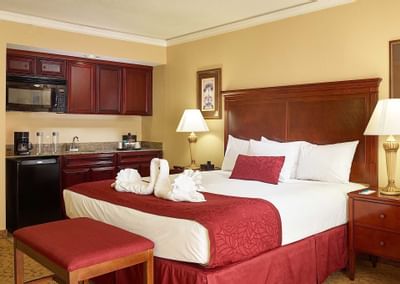room with bed and small kitchenette