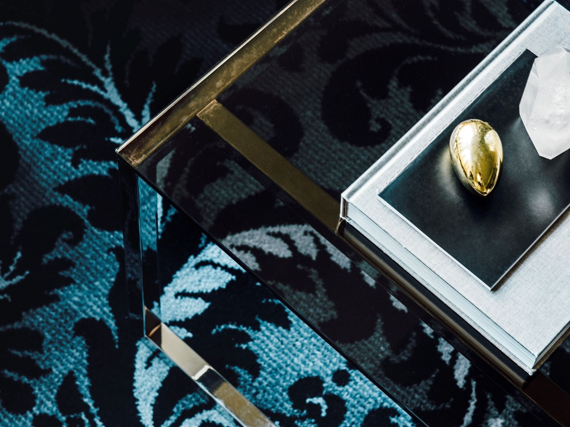 Items on a glass table in Gold Penthouse at Como Melbourne