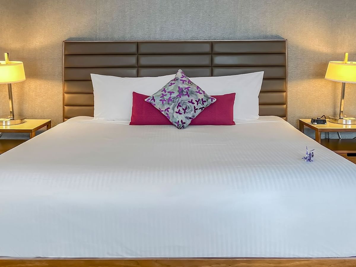 Hotel bed with nightstands and lamps