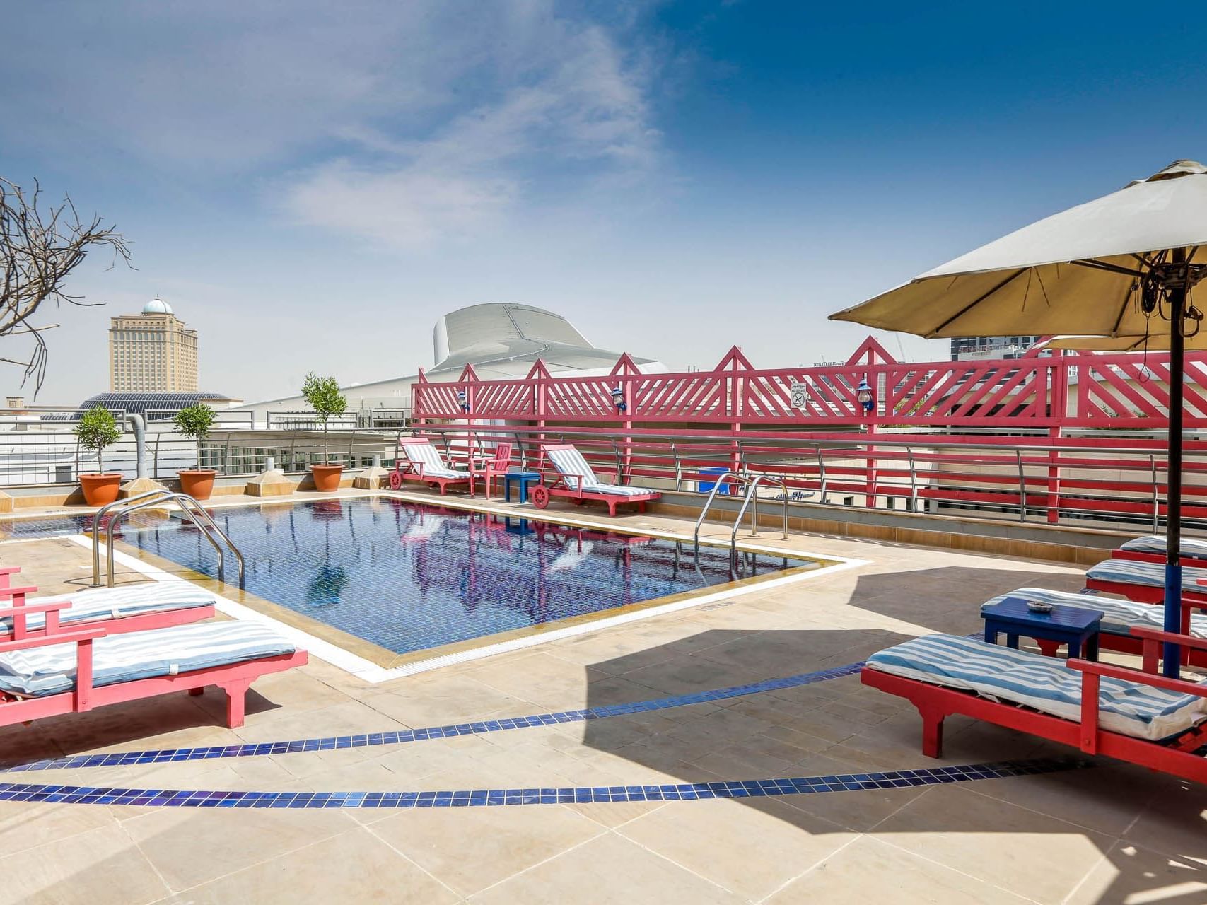 Pool area with pool beds at Mena ApartHotel Albarsha Dubai