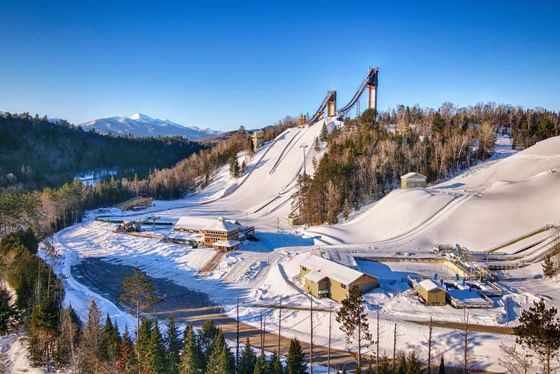 Aerial view of Lake Placid ski jumps on a sunny day near  High Peaks Resort