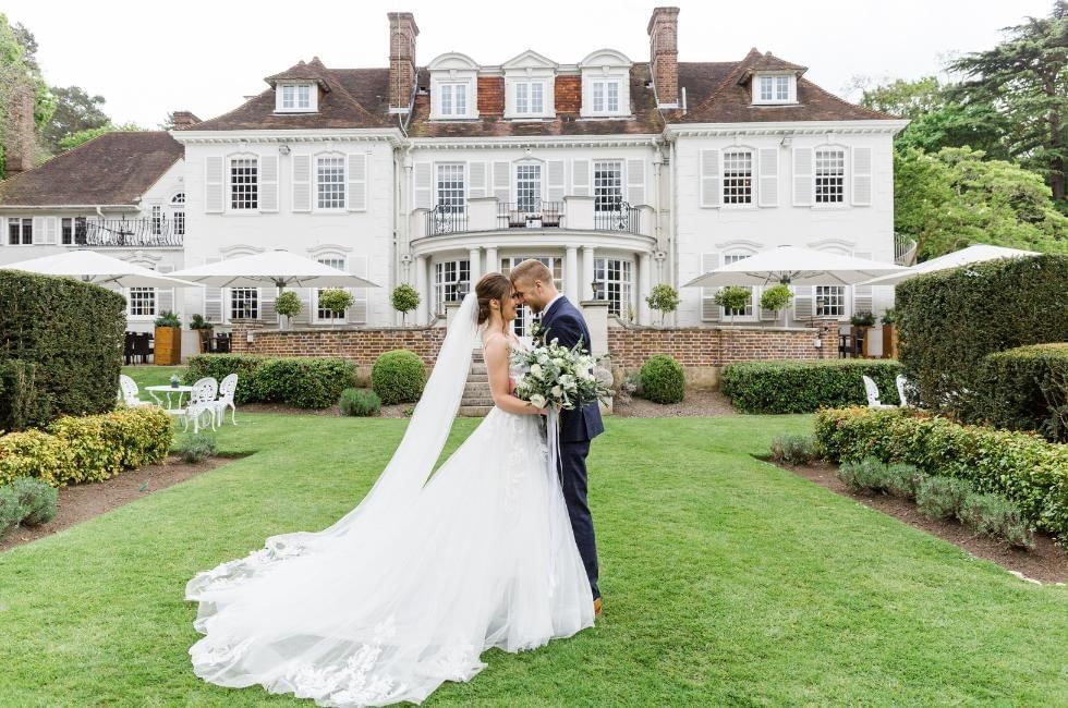 bride and groom outside of gorse hill in woking