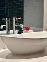 Clean bathroom sink and towels with garden view at Warwick Fiji Resort and Spa in Korolevu.