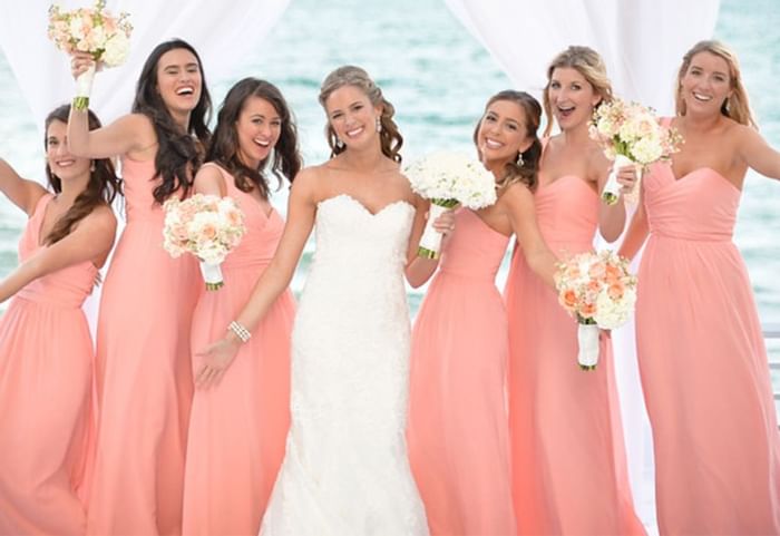 Bride and bridesmaid posing at a wedding, The Diplomat Resort