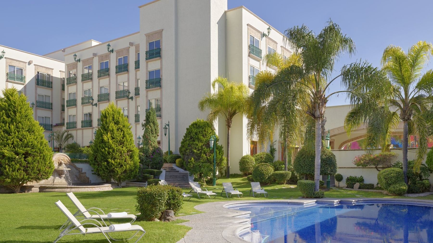 Exterior view of Pool and garden at FA Aguascalientes