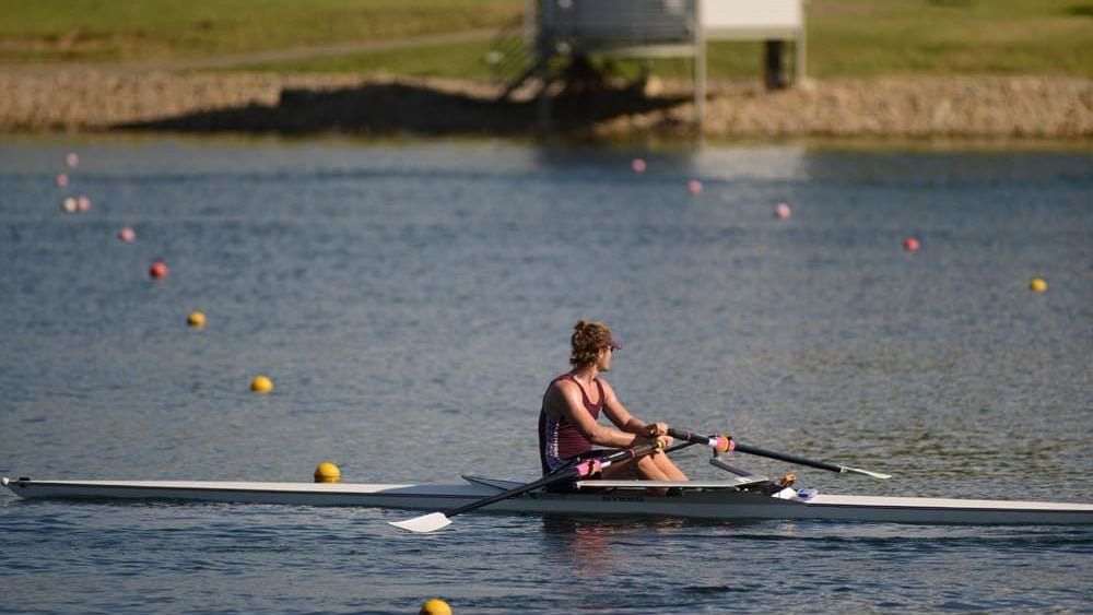A guy sailing in a boat near the Mercure Sydney Parramatta