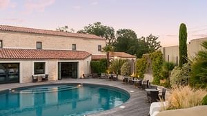 Pool with seating area at Hotel La Grange