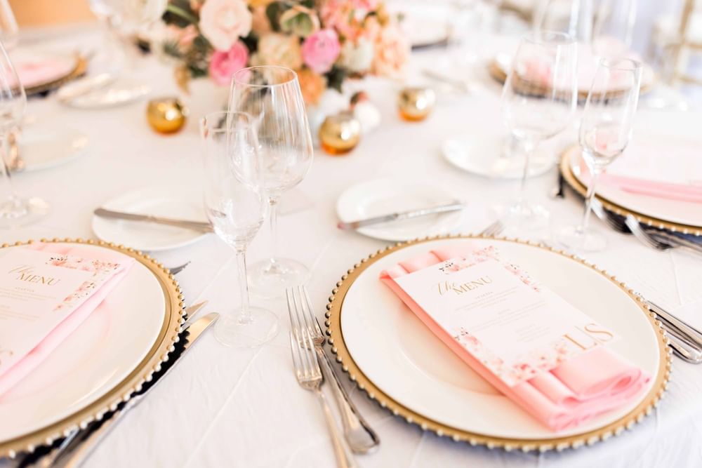 Elegantly set table with pink and gold accents at El Prado Hotel