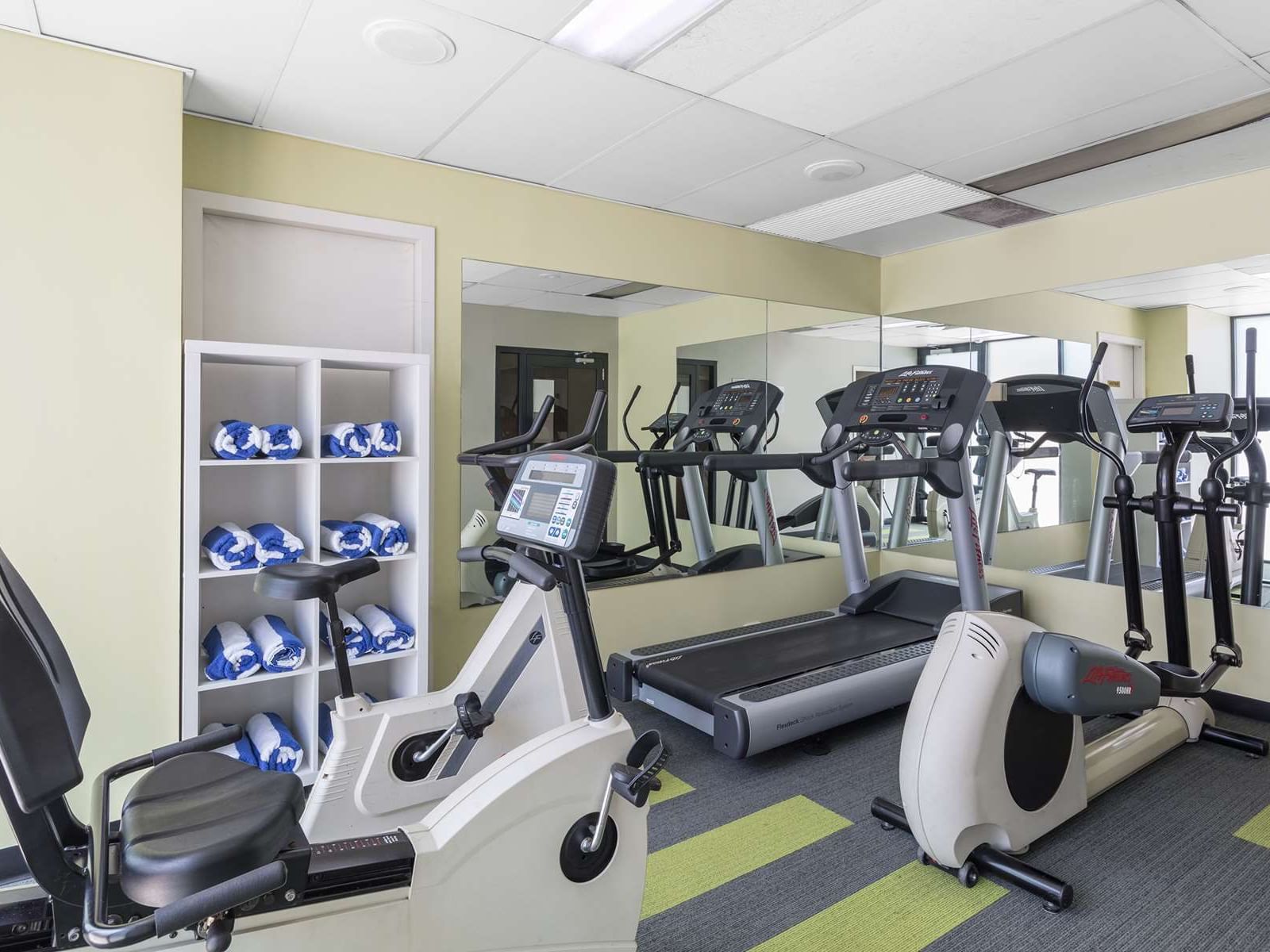 Exercise machines arranged in the gymnasium at Nesuto Hotels