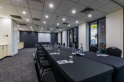 Boardroom meeting table set-up at Amora Hotel Melbourne