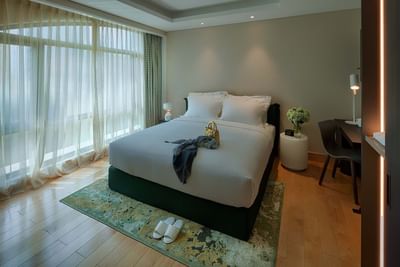spacious hotel room with king bed