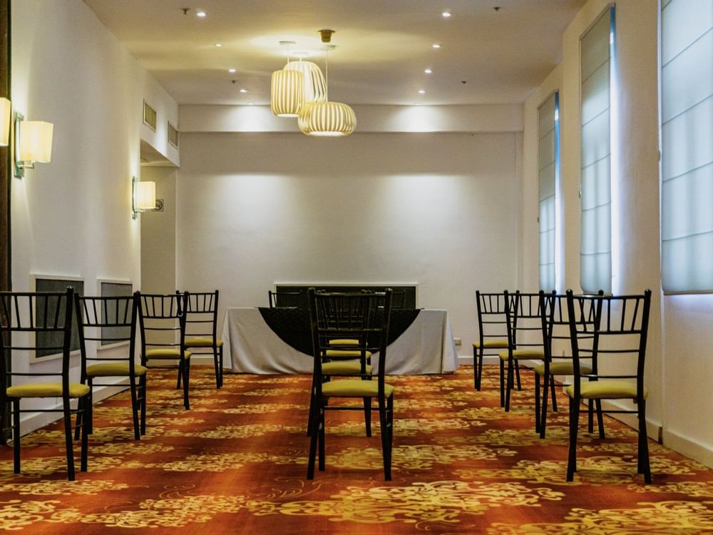 Seating arrangements in Rubi Room at Gamma Hotels