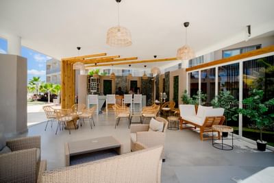 Outdoor patio area with plush seating's at The Hub Acunmeyda 