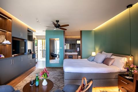 Bed & furniture in Deluxe Rooms at Golden Rock Resort