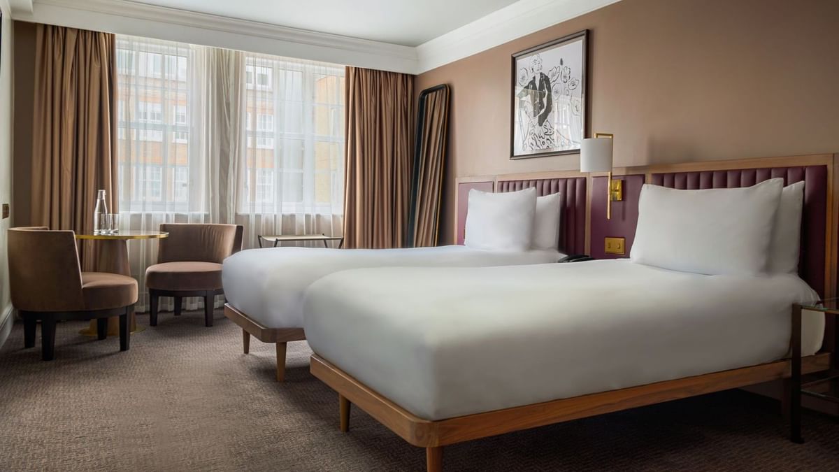 Two beds in an accessible room at The May Fair Hotel, London.