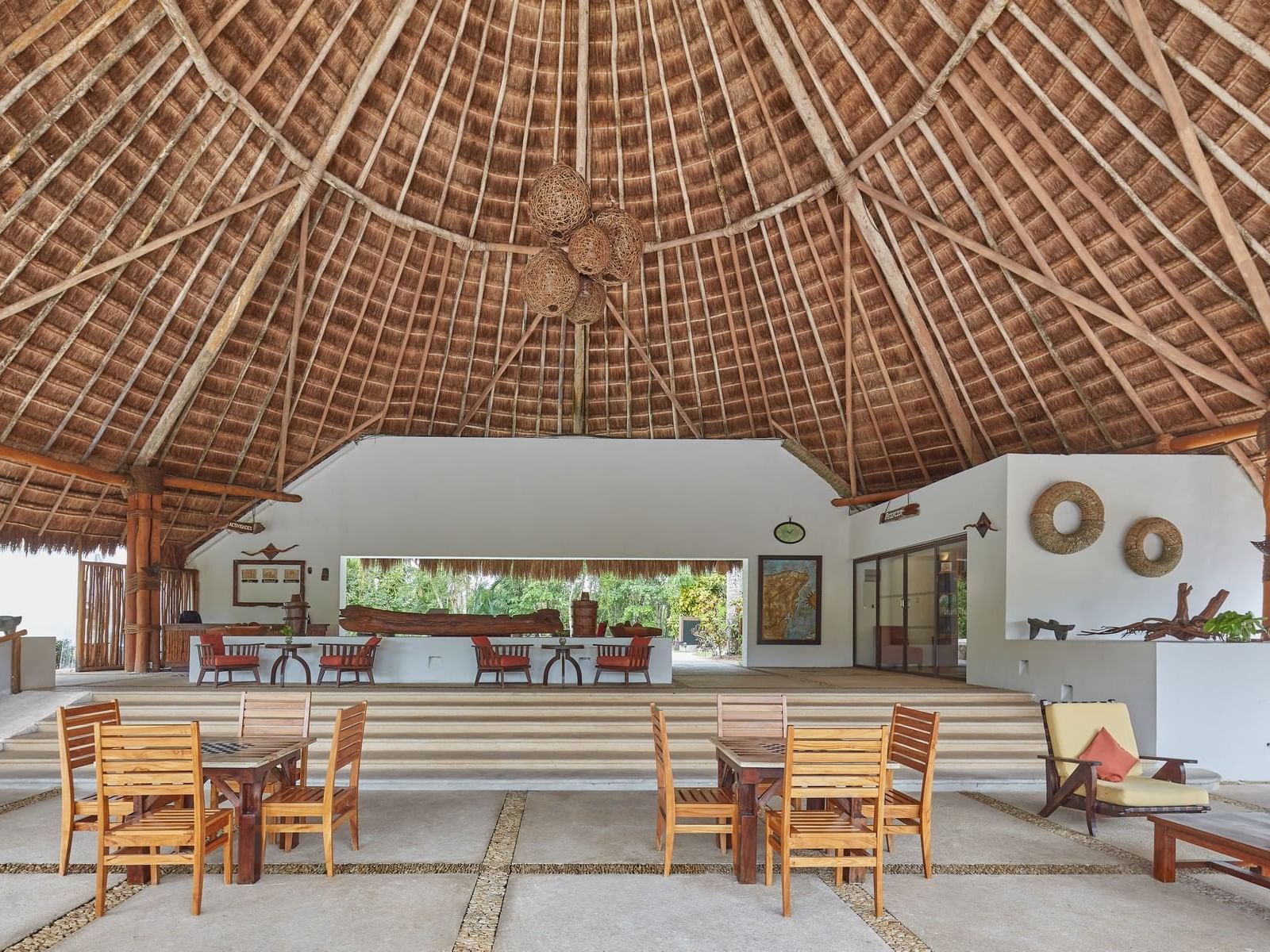 Open & airy bar with wooden furniture at La Colección Resorts