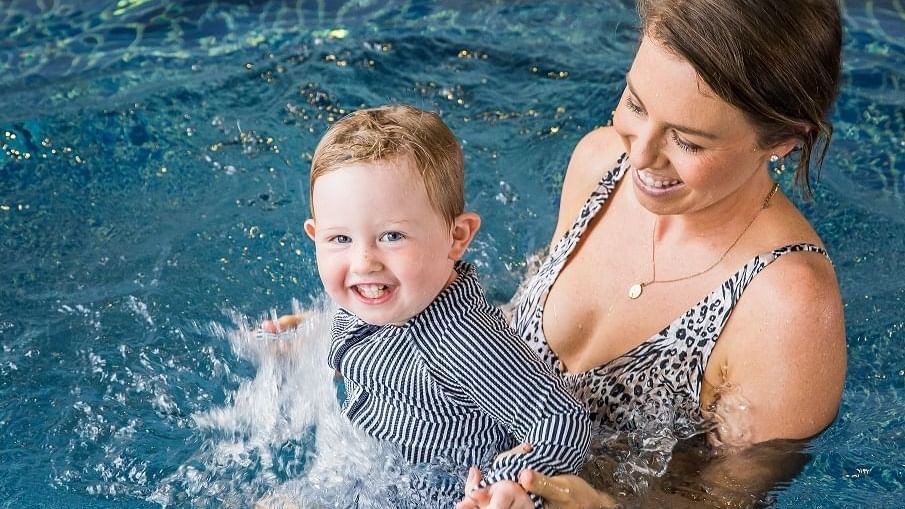 Mother & kid enjoying in the pool at Novotel Darling Square
