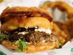 Close-up on burger served in The Burger Dive near Boothill Inn & Suites