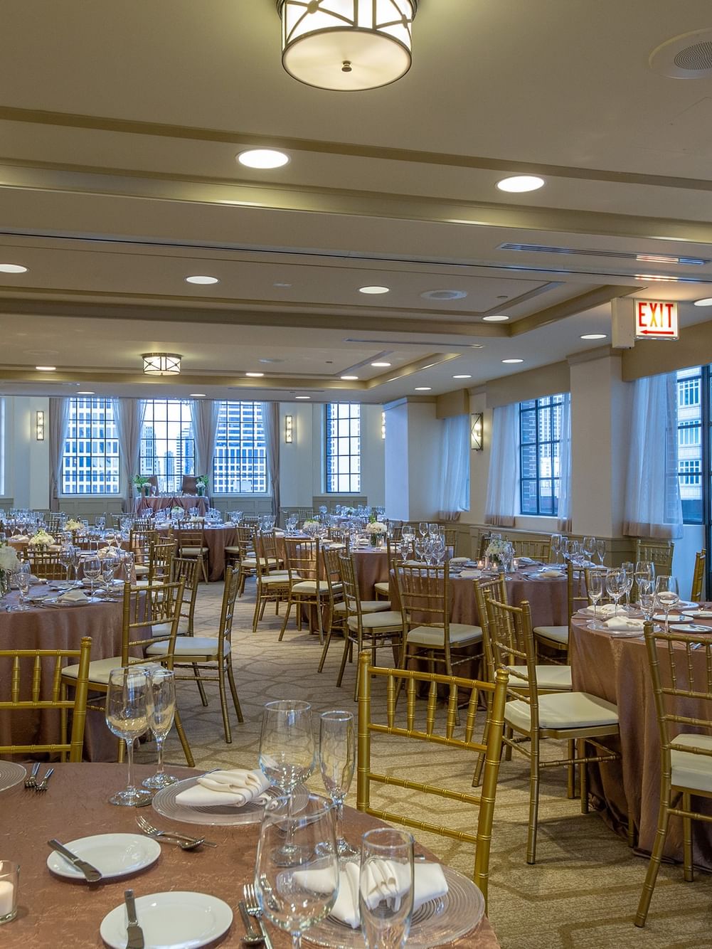 Elegantly set round tables in Tip Top Tap Ballroom at Warwick Allerton - Chicago.