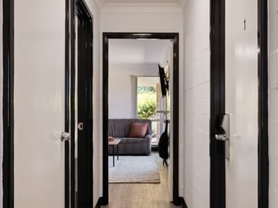 Hallway view leading to a living room at UniLodge at Curtin University - Vickery House.