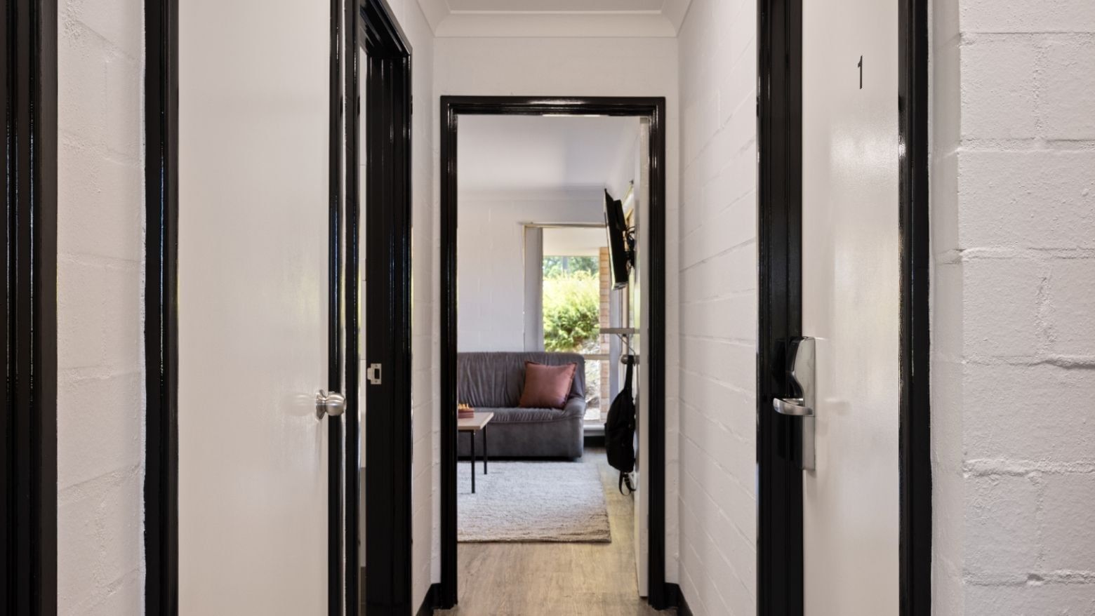 Hallway view leading to a living room at UniLodge at Curtin University - Vickery House.