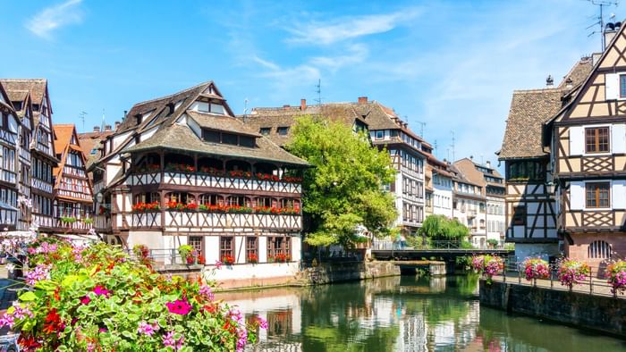 Buildings by a canal in Strasbourg city near Originals Hotels