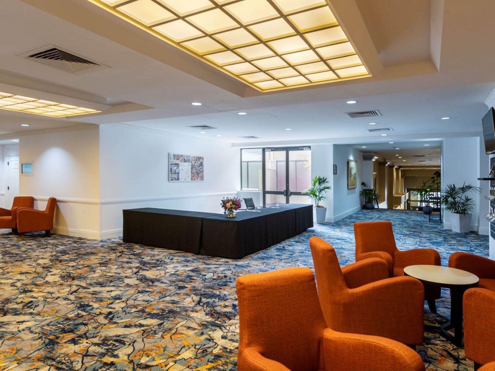 Pre function registration desk & lounge area at Grand Chancellor Adelaide