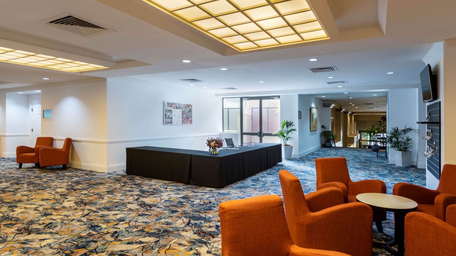 Pre function registration desk & lounge area at Grand Chancellor Adelaide
