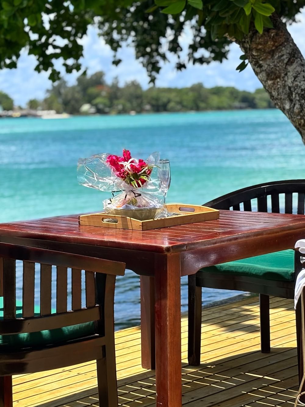 Outdoor dining table with sea view at Warwick Le Lagon - Vanuatu in Efate.