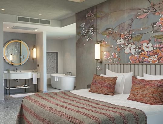 Grand Family with a floral wall art, plush bedding, and an open bathroom concept at Cullinan Belek