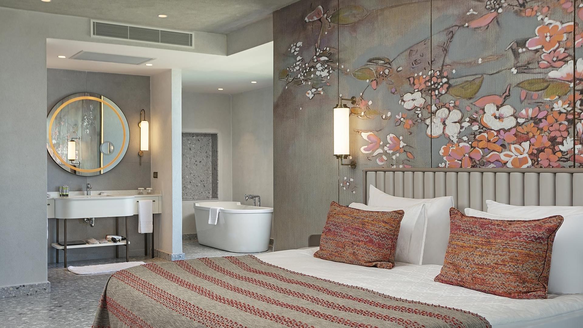 Grand Family with a floral wall art, plush bedding, and an open bathroom concept at Cullinan Belek