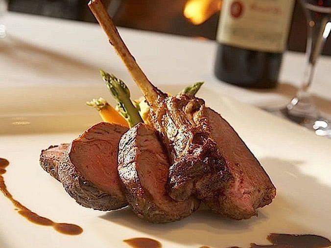 Close-up of a steak dish served in Rustika Steakhouse near Blackstone Mountain Lodge