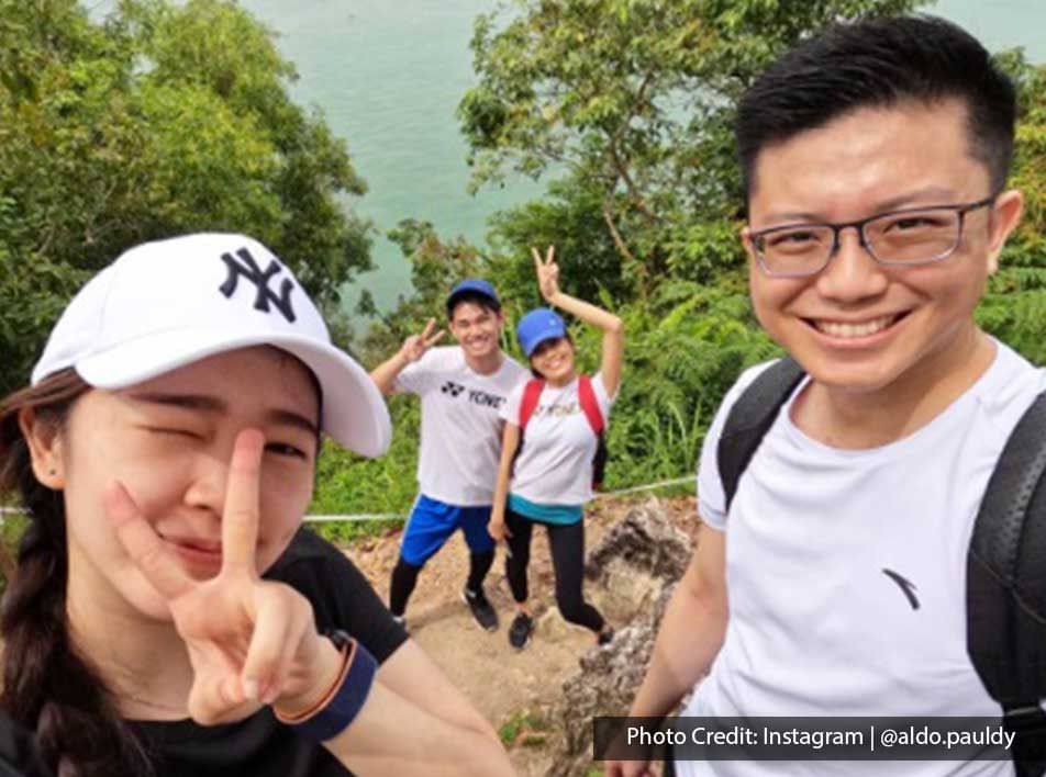 a group of people doing the peace sign while hiking - Lexis PD