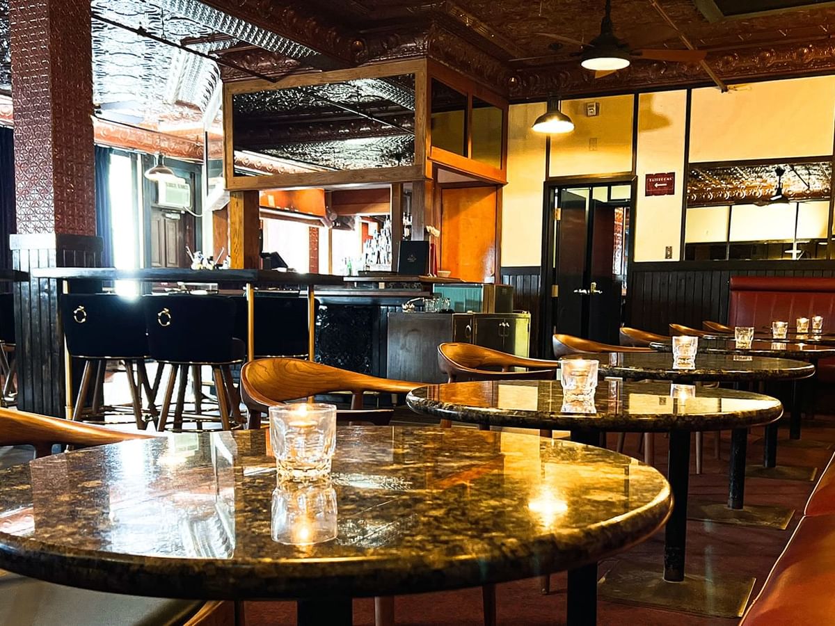 Dining arrangements inMidnight Sun Lounge at Midnight Sun, a Coast Hotel