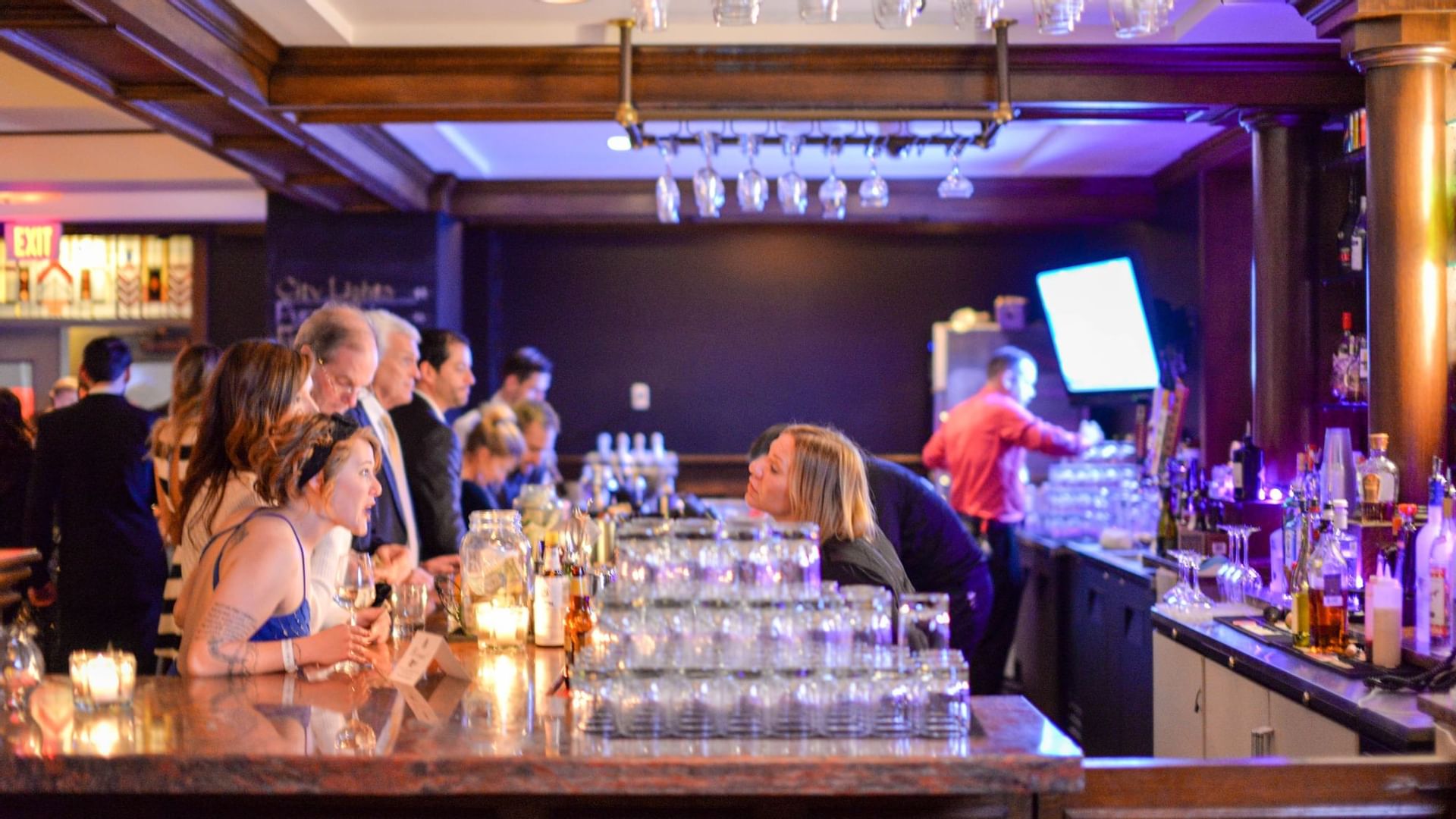 People in The Penthouse Rooftop Bar at The Mayo Hotel