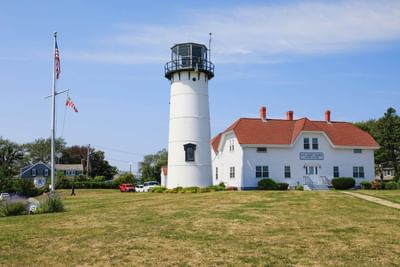 Aerial view of Chatham Lighthouse by the large ground area near Chatham Tides Resort