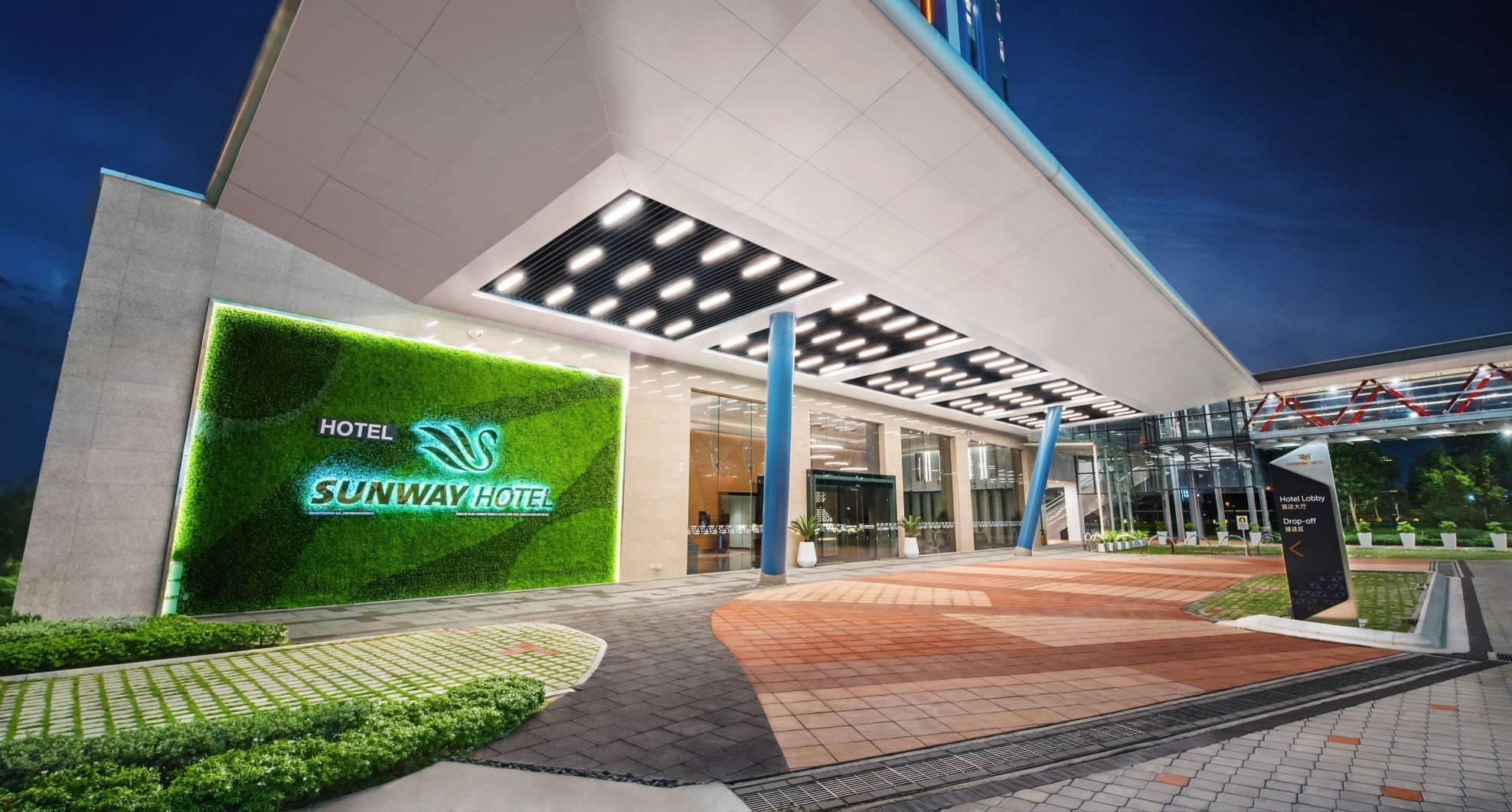 Entrance with green living wall & illuminated canopy at Sunway Hotel Big Box