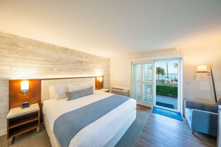 Hotel room with one bed and door to outside 