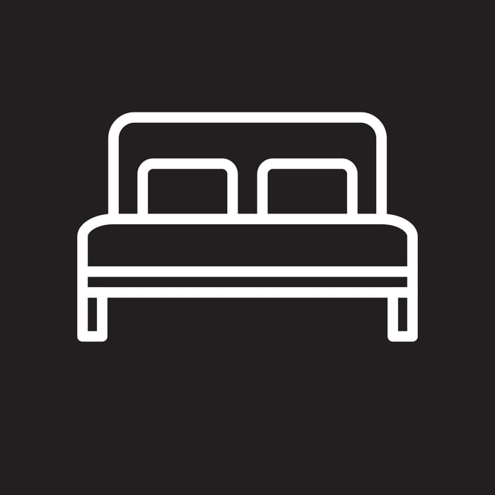 A vector icon of bed at The Godfrey Boston Hotel