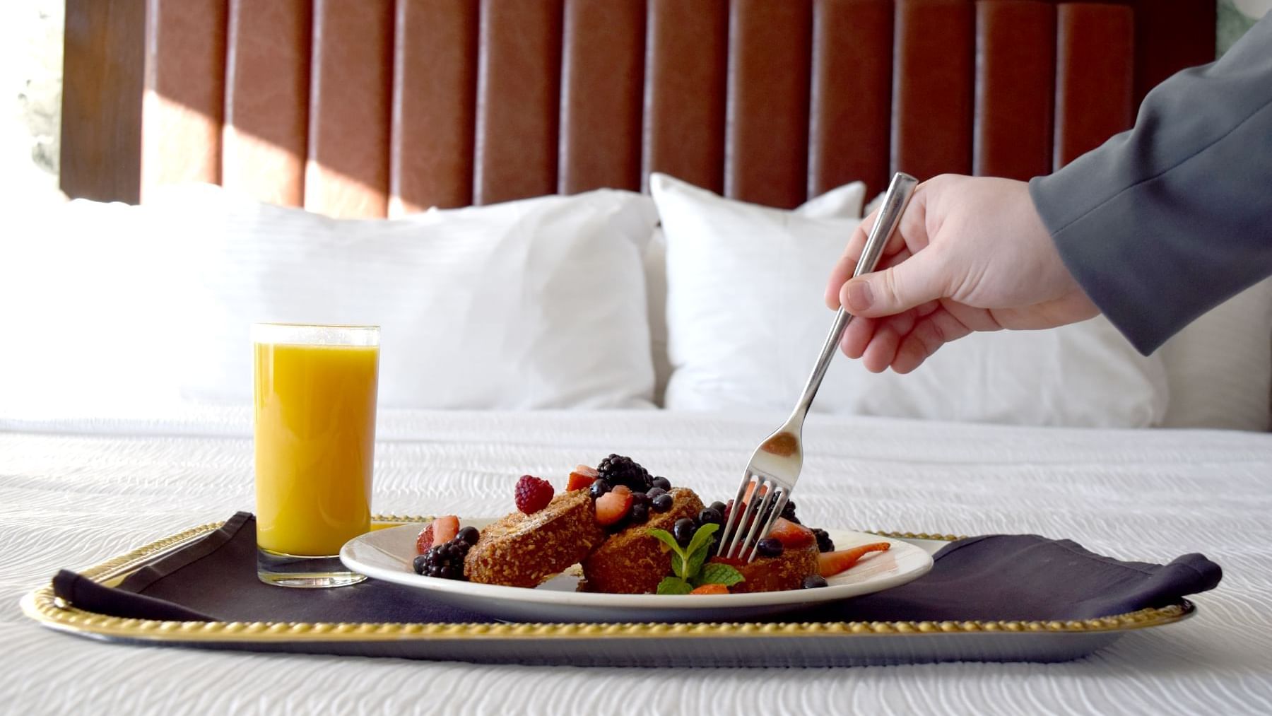 Close up on a dish and a fresh juice served at Grove Hotel