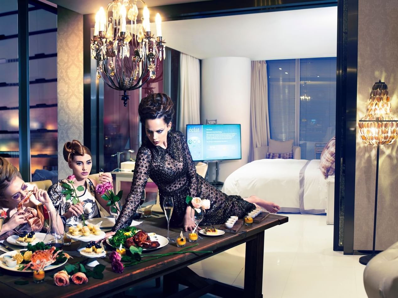 Models posing on a dining table at Hotel Éclat Beijing