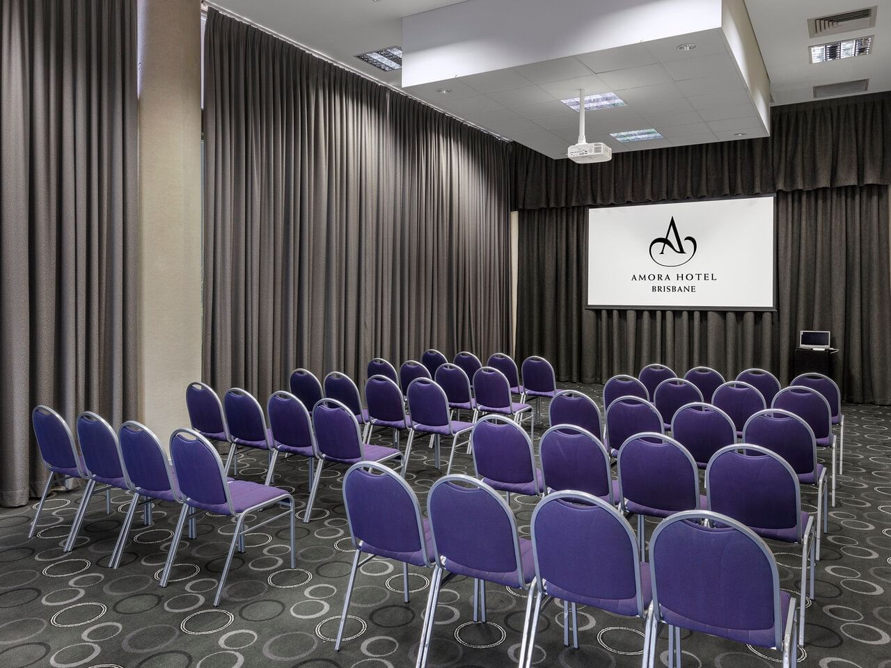 Theatre chair setup in Paterson Meeting Room at Amora Hotel