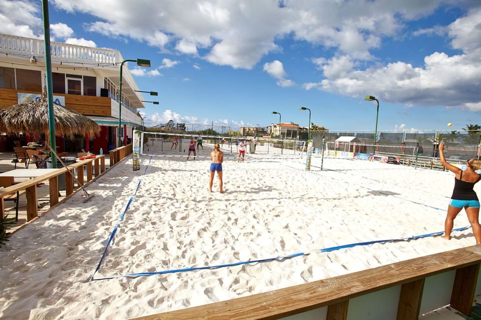 Girls playing beach tennis at Eagle Aruba Resort