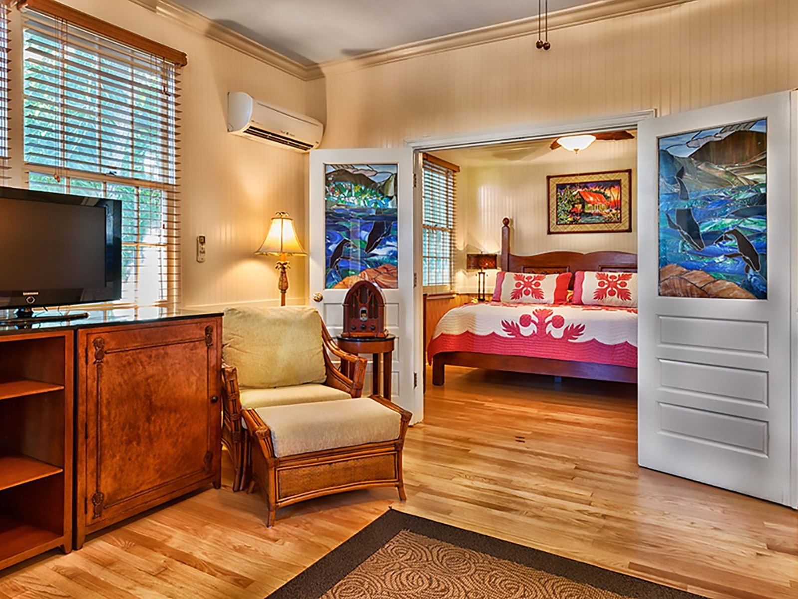 living room with wooden decor and door to bedroom