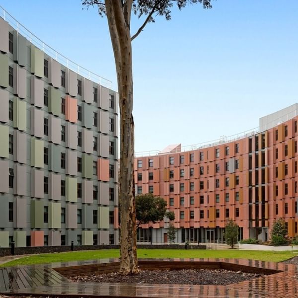 Modern La Trobe University - North and South Apartments with vibrant facade and landscaped courtyard.