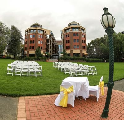 Outdoor wedding reception with hotel view at Amora Hotel