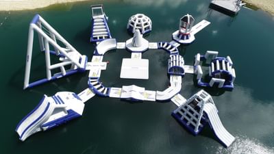 Aerial view of Aqua Park with various climbing structures and slides near Off Shore Resort