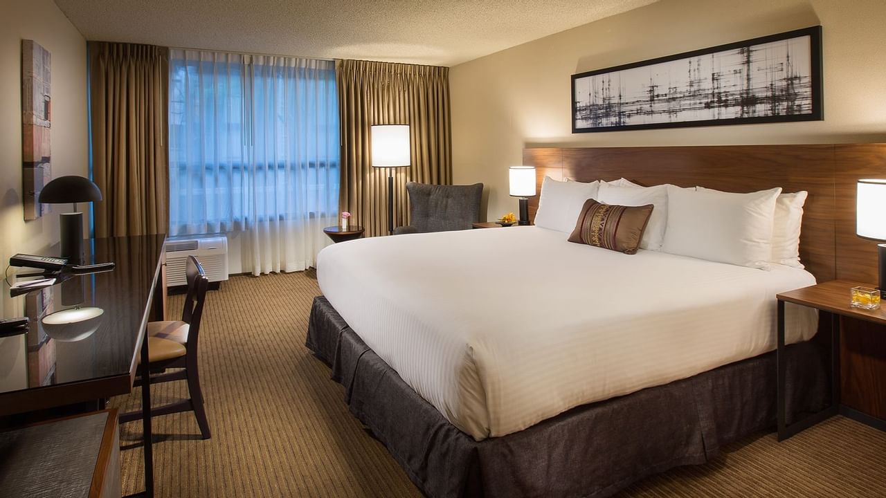 Bed in modern hotel room