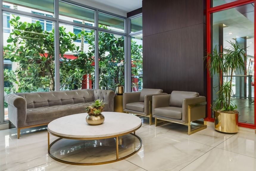 Stylish lobby surrounded by plants at Costa Beach Resort